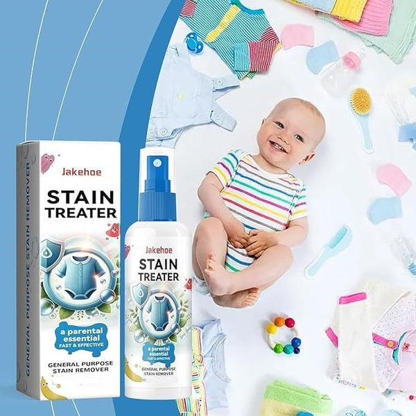 Jakehoe Stain Treater with packaging and a baby surrounded by colorful baby items on a white background.