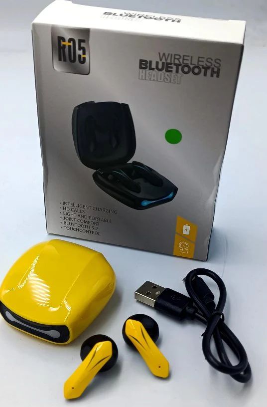 Yellow wireless Bluetooth headphones with charging case, USB cable, and R05 branding on packaging.