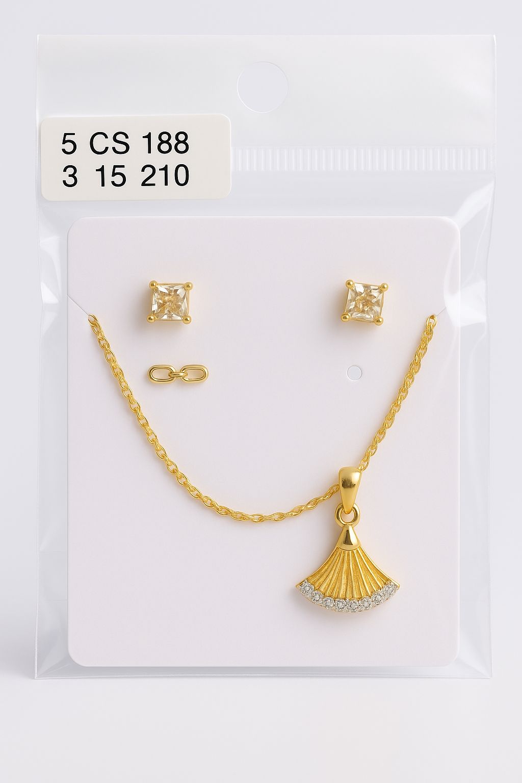 Gold necklace and earrings set on a display card with product numbers.