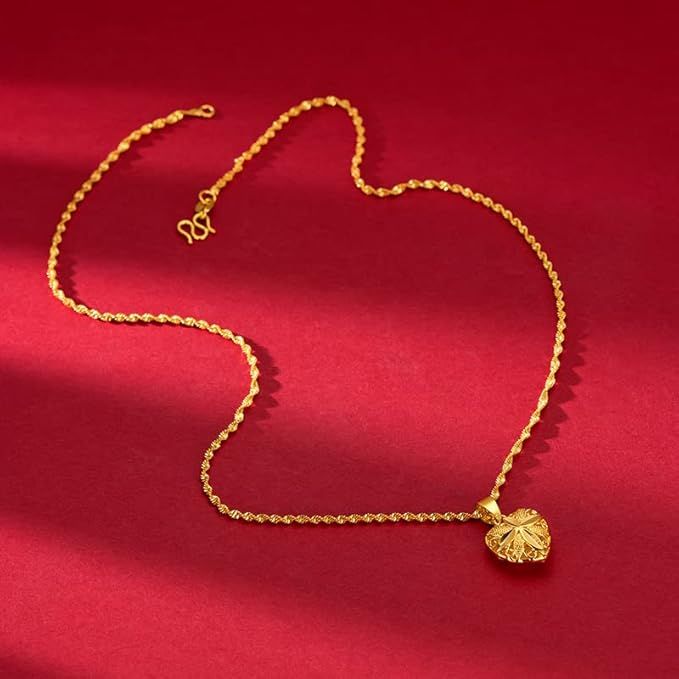 Gold necklace with a shell pendant on a red background