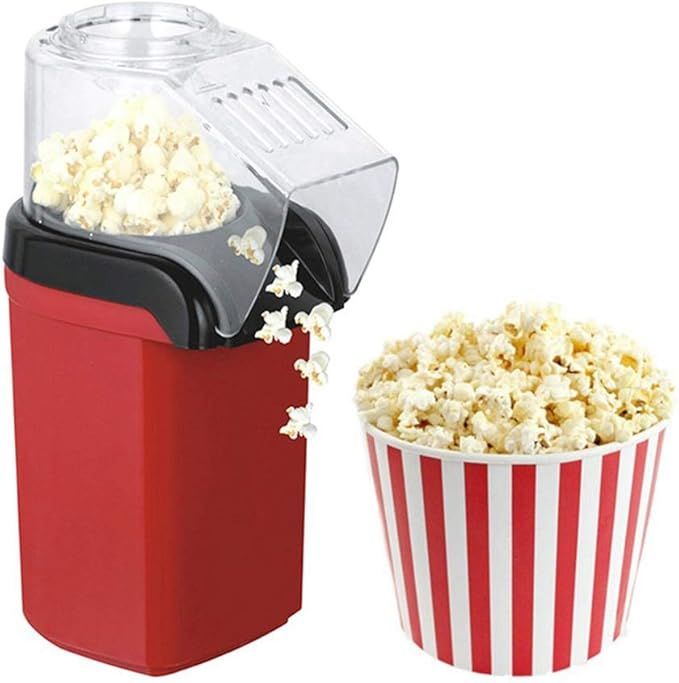 Red popcorn maker with a bowl of popcorn next to it on a white background