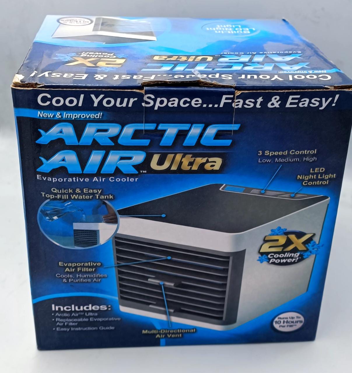 Box of Arctic Air Ultra evaporative air cooler fan with blue and black design.