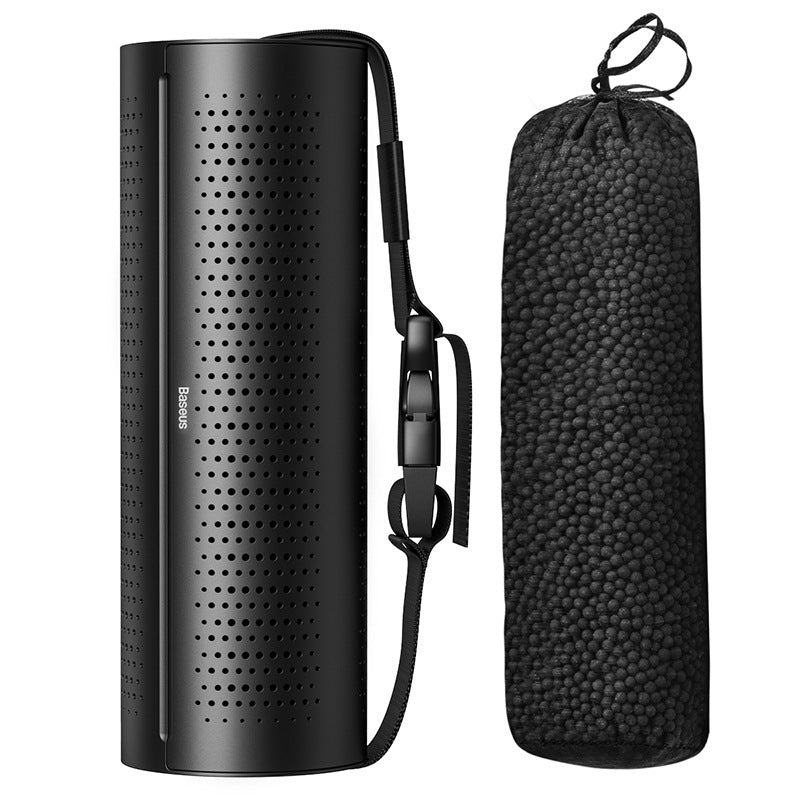 Black portable speaker with carrying strap and case on a white  Original Ecological Carbon Package Car Air Purifier background